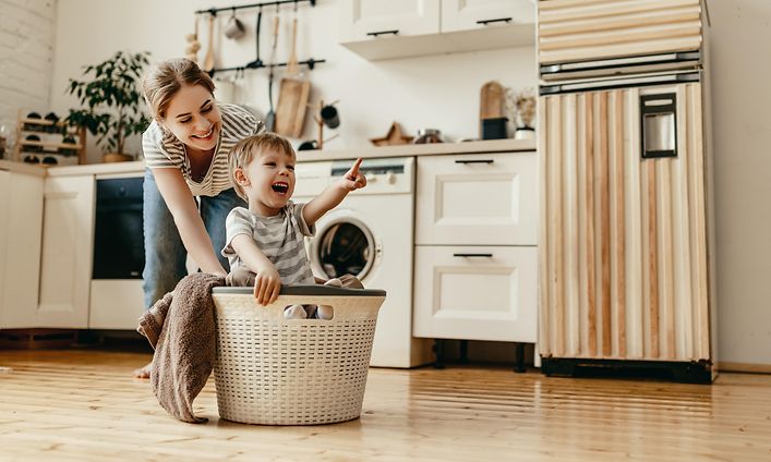 CS - Extended Warranty - A woman and child playing with a laundry basket